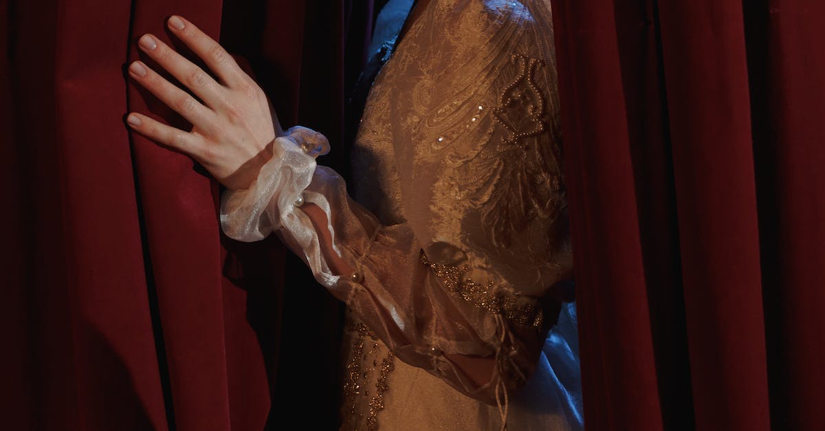 Crop Photo Of Woman Standing Behind A Curtain